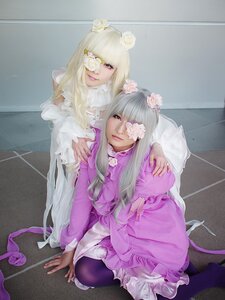 Rating: Safe Score: 0 Tags: 2girls blonde_hair dress eyepatch flower frills hair_flower hair_ornament hair_over_one_eye lips lipstick long_hair looking_at_viewer makeup multiple_cosplay multiple_girls nail_polish pantyhose pink_nails sitting smile tagme very_long_hair wariza white_flower User: admin
