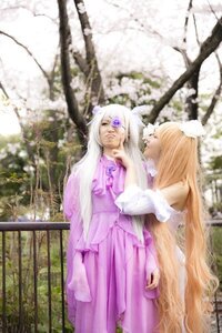 Rating: Safe Score: 0 Tags: 2girls 91076 blonde_hair blurry closed_eyes depth_of_field dress long_hair long_sleeves multiple_cosplay multiple_girls purple_dress purple_eyes standing tagme very_long_hair wide_sleeves yakumo_yukari User: admin