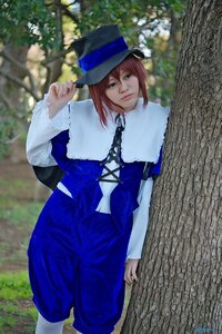 Rating: Safe Score: 0 Tags: 1girl bangs blue_eyes blurry brown_hair capelet depth_of_field hat lips long_sleeves looking_at_viewer outdoors pants red_hair short_hair solo souseiseki tree User: admin