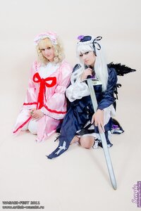 Rating: Safe Score: 0 Tags: 2girls artist_name bangs blonde_hair dress hat holding japanese_clothes katana lips long_hair long_sleeves mob_cap multiple_cosplay multiple_girls ribbon short_hair sword tagme weapon wide_sleeves wings User: admin