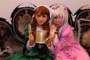 Rating: Safe Score: 0 Tags: 2girls blonde_hair book brown_hair dress eyepatch flower hair_ornament holding_book long_sleeves multiple_cosplay multiple_girls tagme User: admin