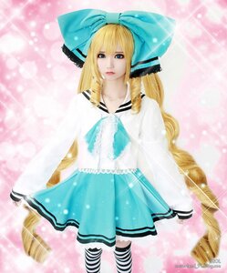 Rating: Safe Score: 0 Tags: 1girl blonde_hair blue_eyes bow dress lips long_hair ribbon shinku skirt solo striped striped_legwear watermark User: admin