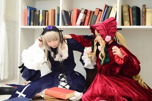 Rating: Safe Score: 0 Tags: 2girls blonde_hair bonnet book closed_eyes dress long_hair long_sleeves multiple_cosplay multiple_girls shinku sitting suigintou tagme User: admin