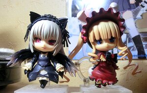 Rating: Safe Score: 0 Tags: 2girls animal_ears black_wings blonde_hair cat_ears chibi doll dress frills hairband long_hair long_sleeves looking_at_viewer multiple_dolls multiple_girls shinku standing suigintou tagme wings User: admin