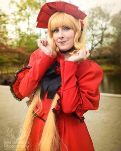 Rating: Safe Score: 0 Tags: 1girl bangs blonde_hair blue_eyes blunt_bangs blurry bonnet day depth_of_field dress flower hat lace lips long_sleeves looking_at_viewer outdoors photo realistic red_dress shinku smile solo User: admin