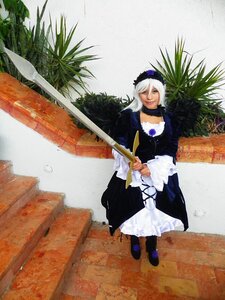 Rating: Safe Score: 0 Tags: 1girl choker dress frills holding long_sleeves solo standing suigintou sword weapon User: admin