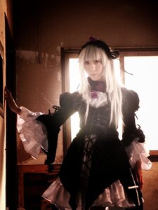 Rating: Safe Score: 0 Tags: 1girl black_dress dress flower frills gothic_lolita indoors lolita_fashion long_hair long_sleeves silver_hair solo standing suigintou white_hair window User: admin
