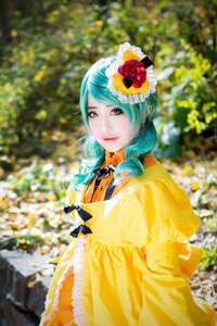 Rating: Safe Score: 0 Tags: 1girl aqua_hair blurry blurry_background blurry_foreground bow depth_of_field dress flower frills kanaria looking_at_viewer outdoors solo yellow_dress User: admin