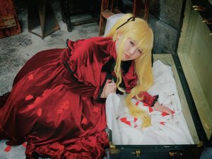 Rating: Safe Score: 0 Tags: 1girl blonde_hair blue_eyes capelet dress hair_ribbon indoors long_hair looking_at_viewer petals red_dress ribbon shinku solo User: admin