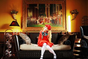 Rating: Safe Score: 0 Tags: 1girl blonde_hair bow couch dress indoors long_hair red_dress shinku sitting solo white_legwear User: admin