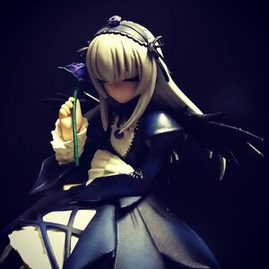 Rating: Safe Score: 0 Tags: 1girl black_dress blonde_hair doll dress hair_over_eyes hairband holding long_hair long_sleeves solo suigintou User: admin