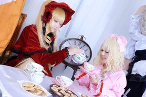 Rating: Safe Score: 0 Tags: 2girls 3girls blonde_hair bonnet closed_eyes cup dress food long_sleeves multiple_cosplay multiple_girls shinku sitting table tagme teacup User: admin