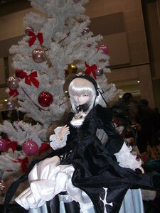 Rating: Safe Score: 0 Tags: 1girl black_dress doll dress flower frills hairband long_hair long_sleeves purple_eyes silver_hair solo suigintou User: admin