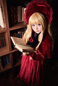 Rating: Safe Score: 0 Tags: 1girl bangs blonde_hair blue_eyes blurry bonnet book bookshelf depth_of_field dress flower holding lips long_hair looking_at_viewer red_dress red_flower rose shinku solo User: admin