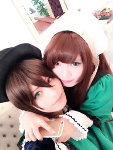 Rating: Safe Score: 0 Tags: 2girls bangs blue_eyes brown_hair cellphone green_dress green_eyes hat heterochromia long_hair looking_at_viewer multiple_cosplay multiple_girls phone red_eyes siblings sisters smile souseiseki suiseiseki tagme twins User: admin