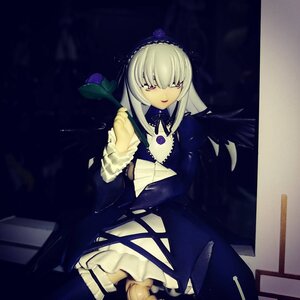 Rating: Safe Score: 0 Tags: 1girl black_dress doll dress frills hairband holding long_hair long_sleeves looking_at_viewer open_book red_eyes rose sitting solo suigintou User: admin