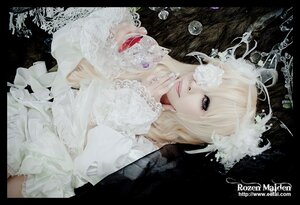 Rating: Safe Score: 0 Tags: 1girl black_background blonde_hair dress english_text flower hair_ornament hair_over_one_eye kirakishou letterboxed lips lolita_fashion long_hair makeup nail_polish solo white_dress User: admin