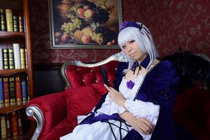 Rating: Safe Score: 0 Tags: 1girl book bookshelf chair couch dress feathers flower frills hairband long_sleeves looking_at_viewer rose sitting solo suigintou white_hair wings User: admin