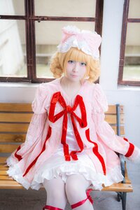 Rating: Safe Score: 0 Tags: 1girl blonde_hair blue_eyes dress frills hat hinaichigo indoors long_sleeves looking_at_viewer ribbon short_hair sitting solo traditional_media window User: admin