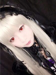 Rating: Safe Score: 0 Tags: 1girl bangs blonde_hair choker closed_mouth hood hood_up lips long_hair looking_at_viewer red_eyes solo suigintou User: admin