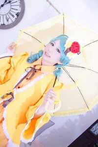 Rating: Safe Score: 0 Tags: 1girl blue_eyes blue_hair flower hair_flower hair_ornament holding_umbrella kanaria parasol raincoat smile solo transparent_umbrella umbrella User: admin