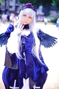 Rating: Safe Score: 0 Tags: 1girl blurry dress feathers long_hair long_sleeves looking_at_viewer red_eyes silver_hair smile solo suigintou wings User: admin