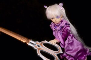 Rating: Safe Score: 0 Tags: 1girl barasuishou black_background doll dress eyepatch frills hair_ornament long_hair long_sleeves purple_dress solo very_long_hair weapon User: admin