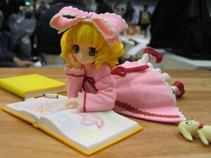 Rating: Safe Score: 0 Tags: 1girl blonde_hair blue_eyes blurry book bow doll dress frills hina_ichigo hinaichigo long_sleeves looking_at_viewer lying on_stomach open_book photo pink_bow pink_dress short_hair solo User: admin