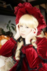 Rating: Safe Score: 0 Tags: 1girl bangs blonde_hair blue_eyes blurry bonnet chin_rest depth_of_field dress flower frills hand_on_own_cheek head_rest lips long_hair long_sleeves shinku solo User: admin