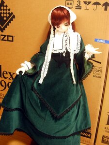 Rating: Safe Score: 0 Tags: 1girl bangs brown_hair doll dress frills green_dress green_eyes heterochromia long_hair long_sleeves looking_at_viewer orange_background solo standing suiseiseki User: admin