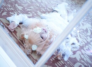 Rating: Safe Score: 0 Tags: 1girl blurry blurry_foreground depth_of_field flower hair_ornament kirakishou looking_at_viewer smile solo User: admin