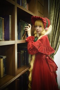 Rating: Safe Score: 0 Tags: 1girl blonde_hair blue_eyes bonnet bookshelf bow dress drill_hair lips long_hair long_sleeves looking_at_viewer red_dress shinku solo standing User: admin