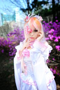 Rating: Safe Score: 0 Tags: 1girl blurry blurry_background blurry_foreground depth_of_field dress flower hair_flower hair_ornament kirakishou lips looking_at_viewer one_eye_covered outdoors photo pink_flower solo User: admin