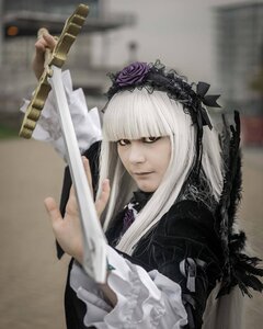 Rating: Safe Score: 0 Tags: 1girl bangs blunt_bangs blurry dress flower frills gothic_lolita holding lolita_fashion long_hair photo rose solo suigintou upper_body weapon User: admin