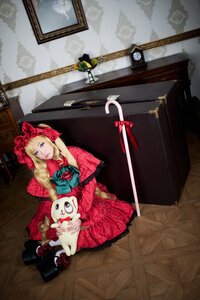 Rating: Safe Score: 0 Tags: 1girl blonde_hair blue_eyes dress flower red_dress shinku sitting solo stuffed_animal weapon User: admin