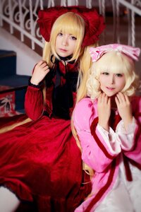 Rating: Safe Score: 0 Tags: 2girls blonde_hair blue_eyes blurry blurry_background blurry_foreground bow depth_of_field dress drill_hair long_hair long_sleeves looking_at_viewer multiple_cosplay multiple_girls photo red_dress smile tagme User: admin