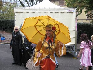 Rating: Safe Score: 0 Tags: black_umbrella blonde_hair braid city dress flower frills hair_ornament holding holding_umbrella kanaria long_hair multiple_girls outdoors parasol rain red_umbrella shared_umbrella solo street transparent_umbrella tree umbrella User: admin