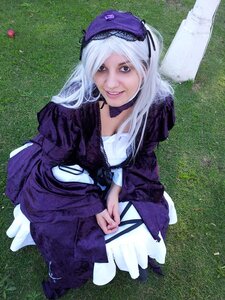 Rating: Safe Score: 0 Tags: 1girl dress grass green_background grin hat long_hair long_sleeves looking_at_viewer sitting smile solo suigintou teeth User: admin