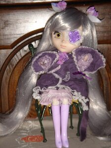 Rating: Safe Score: 0 Tags: 1girl barasuishou chair doll dress eyepatch frills long_hair long_sleeves photo purple_legwear sitting solo tail yellow_eyes User: admin