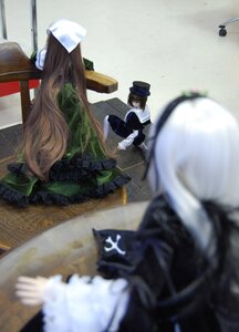 Rating: Safe Score: 0 Tags: apron blurry blurry_background blurry_foreground brown_hair depth_of_field doll dress hat long_hair motion_blur multiple_dolls multiple_girls short_hair sitting tagme User: admin