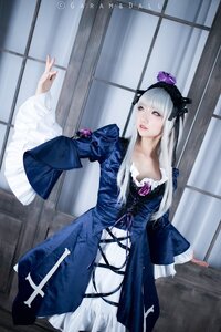Rating: Safe Score: 0 Tags: 1girl bangs dress flower hair_ornament indoors lips long_hair long_sleeves solo standing suigintou window User: admin