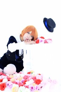 Rating: Safe Score: 0 Tags: 1girl black_headwear blue_eyes flower hat hat_removed headwear_removed long_sleeves orange_hair pink_rose red_flower red_rose rose short_hair solo souseiseki striped top_hat white_rose User: admin