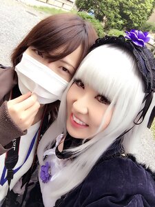 Rating: Safe Score: 0 Tags: 2girls brown_hair flower looking_at_viewer mask mouth_mask multiple_girls red_eyes smile solo suigintou white_hair User: admin