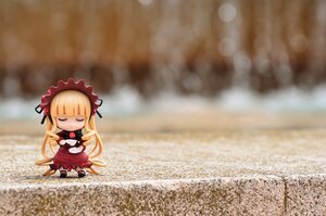 Rating: Safe Score: 0 Tags: 1girl blonde_hair blurry bow chibi closed_eyes doll dress frills long_hair long_sleeves ribbon shinku solo very_long_hair User: admin