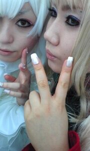 Rating: Safe Score: 0 Tags: 2girls bangs blonde_hair closed_mouth fingernails jewelry lips long_hair looking_at_viewer multiple_cosplay multiple_girls nail_polish nose realistic ring short_hair tagme User: admin