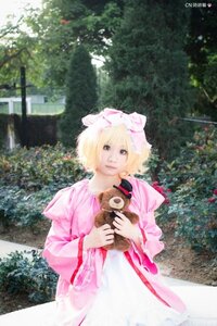 Rating: Safe Score: 0 Tags: 1girl blonde_hair blurry day dress hat hinaichigo long_sleeves mob_cap outdoors photo_background short_hair solo standing stuffed_animal tree wide_sleeves User: admin