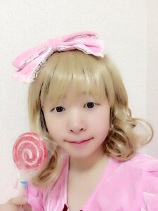 Rating: Safe Score: 0 Tags: 1girl bangs black_eyes blonde_hair bow closed_mouth food hinaichigo lips looking_at_viewer portrait realistic solo upper_body User: admin