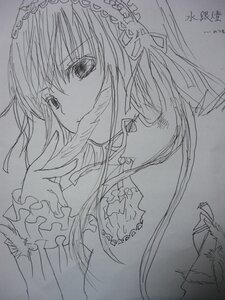 Rating: Safe Score: 0 Tags: 1girl closed_mouth frills greyscale hair_ribbon hairband image long_hair long_sleeves looking_at_viewer monochrome ribbon signature simple_background sketch solo suigintou traditional_media upper_body User: admin