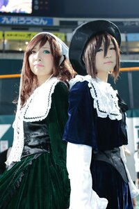 Rating: Safe Score: 0 Tags: 2girls blurry blurry_background brown_hair building depth_of_field dress green_eyes hat lips long_hair long_sleeves looking_at_viewer multiple_cosplay multiple_girls tagme User: admin