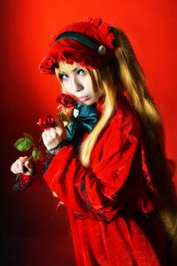 Rating: Safe Score: 0 Tags: 1girl blonde_hair blue_eyes bow dress flower long_hair red_background red_dress red_flower red_rose rose shinku solo User: admin